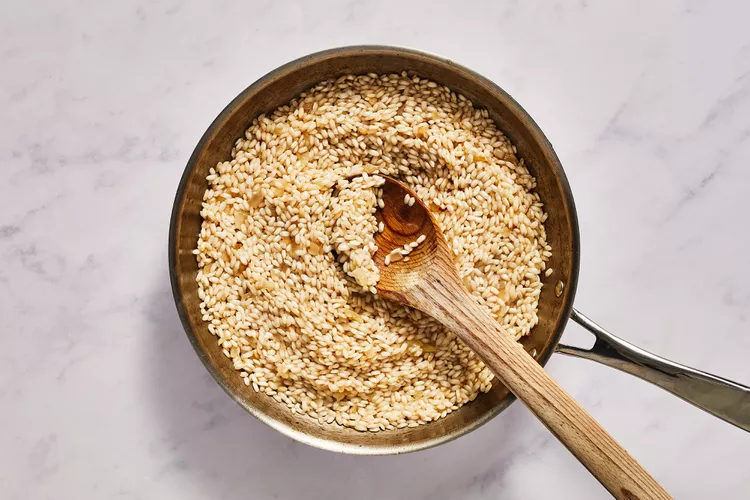 add stock and stir until rice is dry, repeat